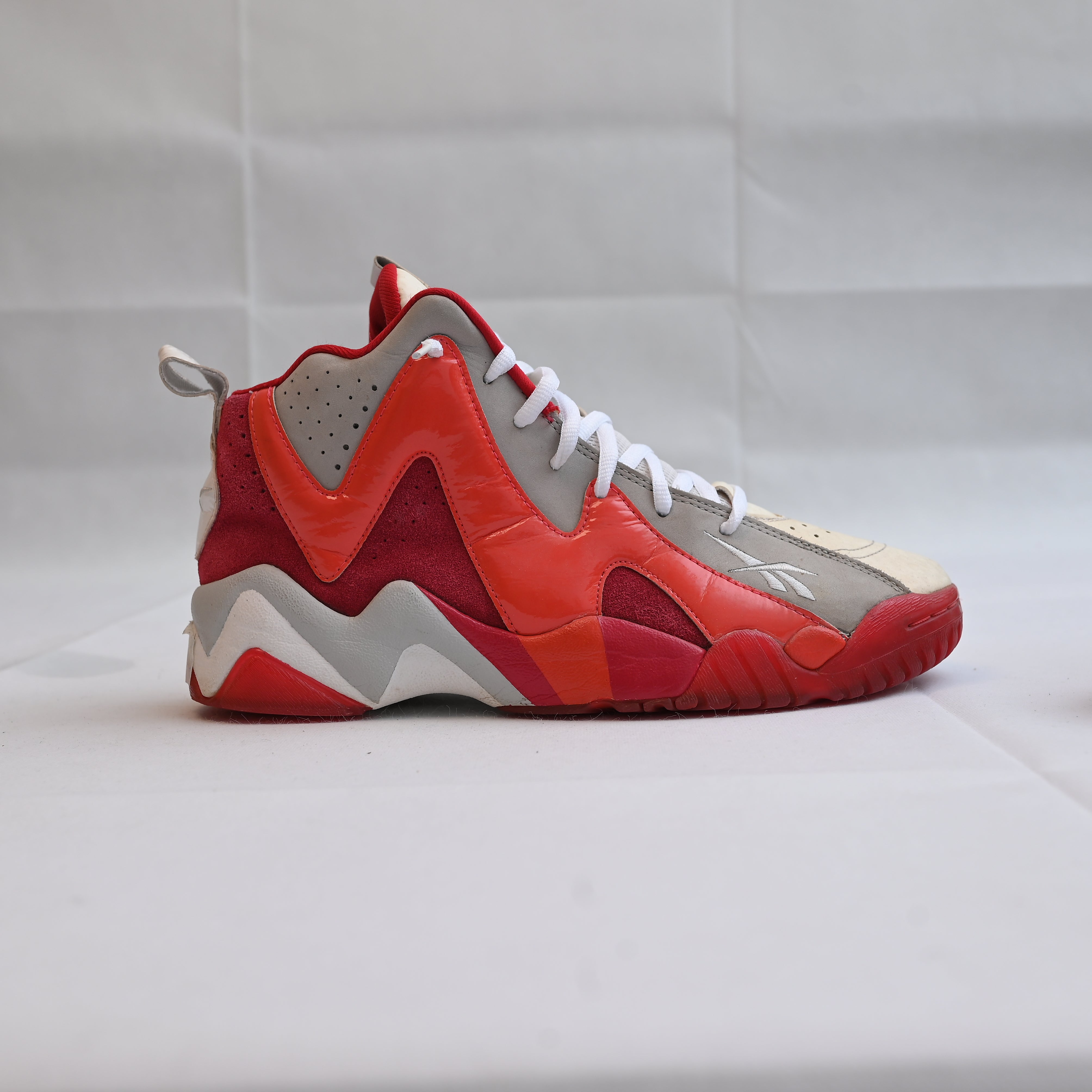 Reebok white, red, and grey basketball shoes. Only worn a handful of times and in very good condition. Men’s size